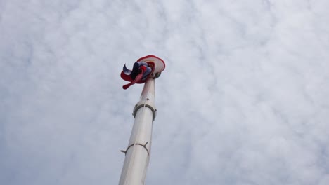 Flag-droops-down-after-a-strong-wind-as-the-camera-captures-this-under-the-flagpole-of-the-the-Philippine-National-Flag