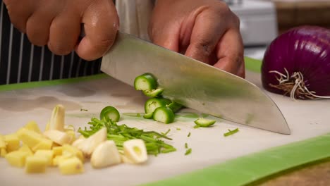 Chopping-serrano-peppers-with-ginger-and-garlic-cloves---Chana-Masala-series