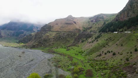 Drone-flyover-viewpoint-Tergi-valley-Kazbegi-mountain-road-pass-Georgia