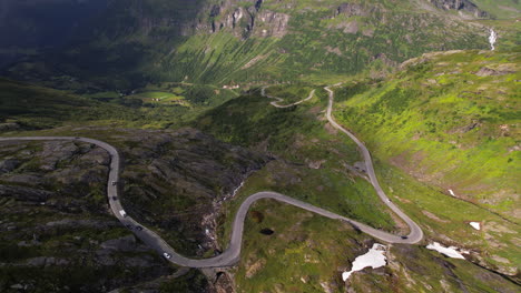 Road-Trip-Through-Mountains-and-Hills-Towards-Geirangerfjord-in-Geiranger-Region-in-Norway,-Aerial-View