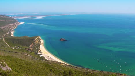 Gorgeous-panoramic-view-of-the-green-landscape-and-blue-Atlantic-Ocean-from-Portinho-da-Arrábida,-Portugal