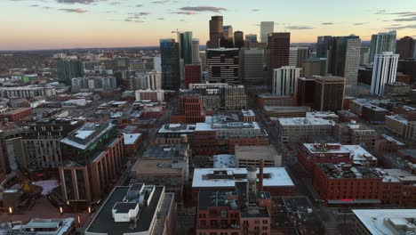 Sunset-Aerial-Drone-Flyover-of-Downtown-Denver,-Colorado,-USA