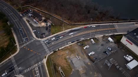 An-aerial-time-lapse-of-a-large-intersection-on-Long-Island,-NY-on-a-cloudy-day