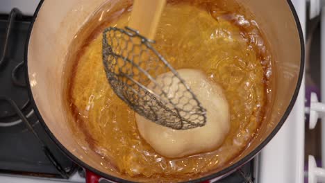 Top-down-view-of-frying-dough-for-bhatura-Indian-bread---Chana-Masala-series
