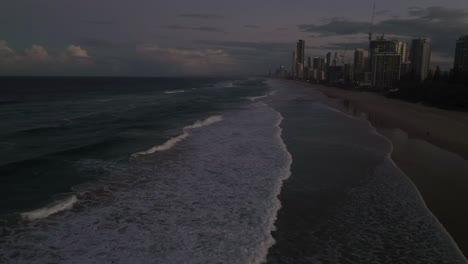 Gold-Coast,-Surfers-Paradise,-Queensland,-Australia,-drone,-looking-south,-over-the-golden-skies-as-night-approaches