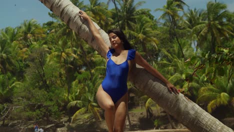 Enjoying-the-Caribbean-paradise-on-the-island-of-Trinidad,-a-Hispanic-girl-in-a-bikini-savors-the-delights-of-the-tropical-beach
