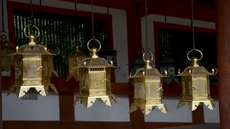 Row-Of-Gold-Japanese-lanterns-at-Kasuga-taisha-Shrine