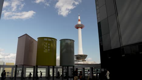 Kyoto-Tower-Viewed-From-Upper-Level-Viewing-Plaza-At-Kyoto-Station-On-Sunny-Day-With-Blue-Skies