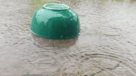 a-bowl-flooded-with-water-when-it-rains