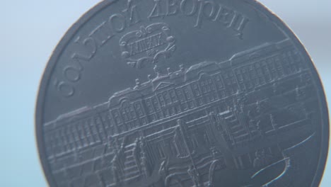 Hyper-macro-shot-of-an-old-metal-Russian-5-Ruble-coin,-CCCP-SSSR-symbol,-back-side,-vintage-money,-cinematic-4K-video-pan-left
