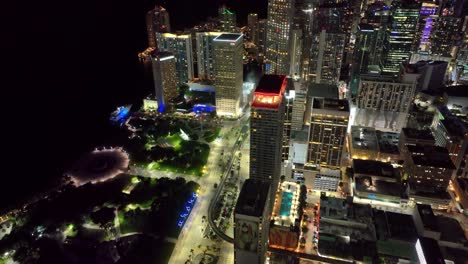 Miami's-nighttime-allure-unfolds-in-this-aerial-view,-showcasing-landmark-buildings-and-the-vibrant-city-traffic
