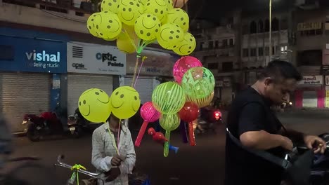 pov-shot-A-brother-with-a-balloon-is-selling-colorful-balloons
