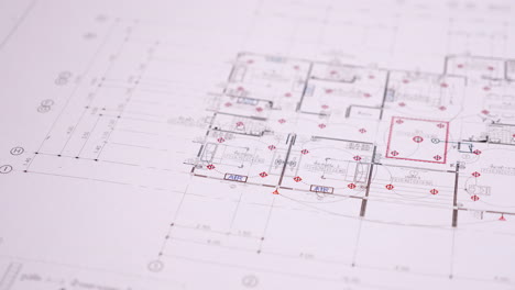 Architect's-workspace-with-building-plans