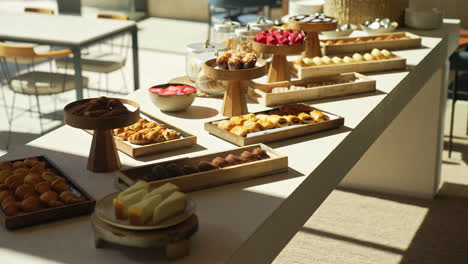 Enjoy-a-lavish-pastry-table-at-a-hotel-brunch-with-glamorous-cakes-and-croissants-beautifully-lit-by-sun