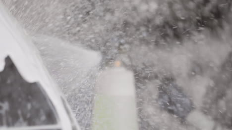 Applying-Spray-Foam-Soap-Directly-to-a-Shiny-Car-Surface
