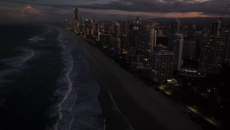 Surfers-Paradise,-Gold-Coast,-Queensland,-Australia,-drone,-just-after-sunset,-lcity-lights-are-turned-on-at-this-wonderful-destination