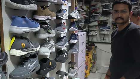 POV-SHOT,-Young-boy-shopping-for-shoes-in-sports-shop