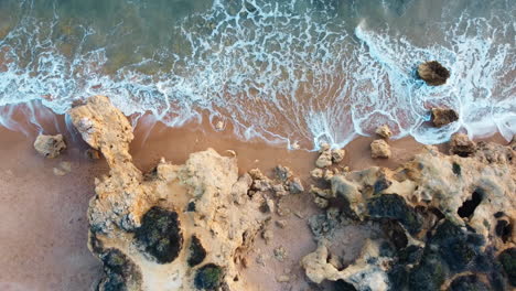 Overhead-view-of-waves-crashing-on-a-rocky-shore-in-Portugal