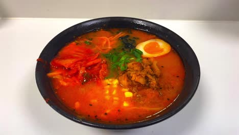 Hot-plate-of-freshly-made-Miso-Ramen-Japanese-spicy-noodle-soup-in-bowl