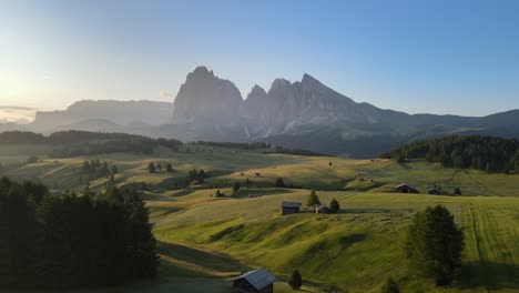 Alpe-De-Siusi-filmed-with-a-drone-during-sunrise-in-the-Italian-Alps,-Dolomites-aerials