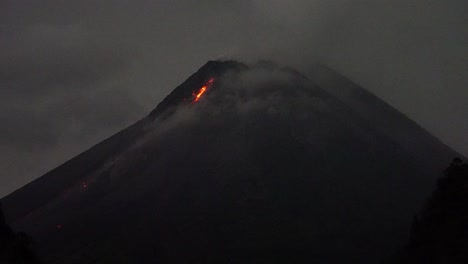 flow-of-incandescent-lava-fire-bon-Mount-Merapi-which-is-partially-covered-by-thick-fog