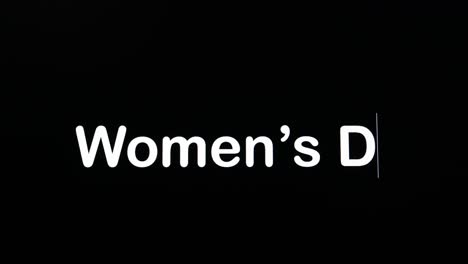 Text-written-on-black-screen-with-the-word-Women's-Day-in-white