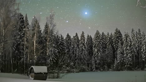 Wooden-cabin-covered-with-snow-under-the-starry-night-sky