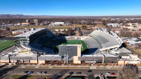 Drone-Flying-up-to-Colorado-State-University-Canvas-Football-sports-stadium-in-Fort