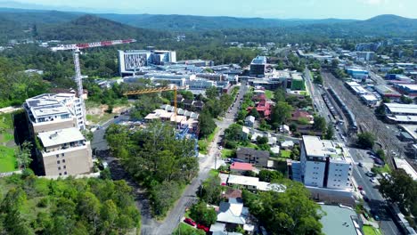 Drone-aerial-landscape-Gosford-city-Hospital-town-and-buildings-crane-construction-healthcare-services-infrastructure-Central-Coast-Australia-4K
