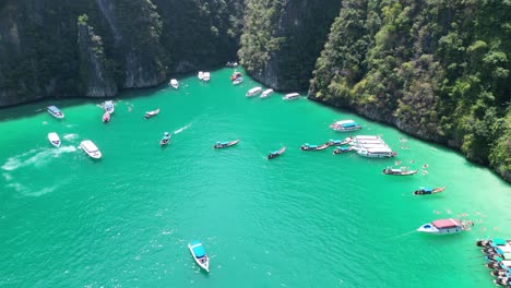 Aerial-View-of-tour-boats-at-crowded-Pileh-lagoon-in-Phi-phi-island