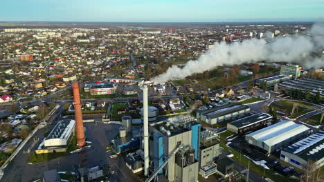 An-Aerial-View-Of-A-Townscape-And-An-Industrial-Area-With-Smoke-Coming-Out-Of-The-Chimney-Stack