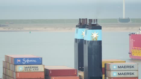 Maersk-container-vessel-funnels,-black-vertical-pipe-like-structures