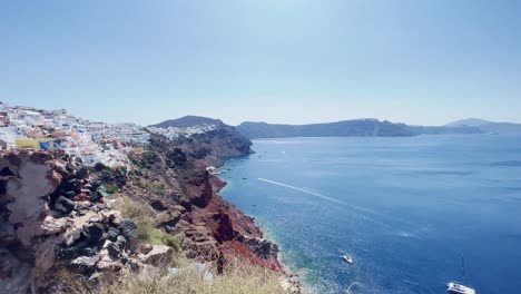Oia-Santorini-Greece-Island-Travel-Tourist-Immersive-Walk,-Europe,-4K-|-Greek,-Aegean,-Sea,-Cliffside,-Ocean,-City,-Vacation,-Shopping,-White,-Marble,-Crowd,-Flowers,-Traveler,-People,-View,-Scenic