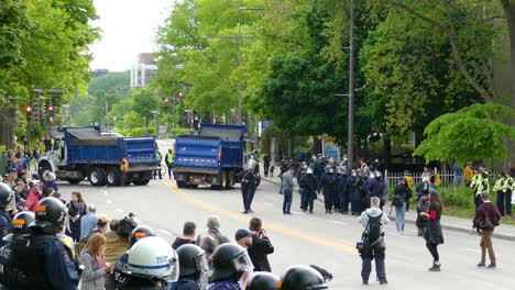 Blocked-road-by-trucks-and-police-marching-the-streets-in-Quebec-city,-Canada
