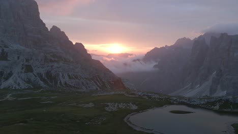 scenic-aerial-in-the-Dolomites,-Italian-alps-from-a-lake-in-the-mountains