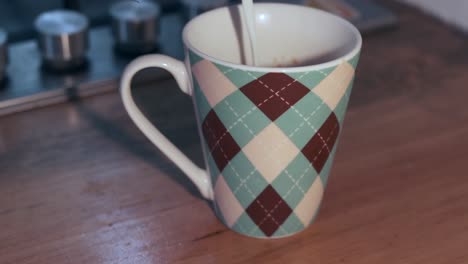Argyle-pattern-ceramic-mug-on-wooden-countertop