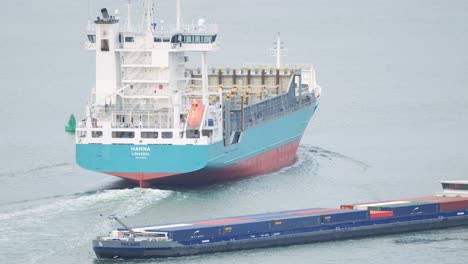 Container-vessel-and-sturdy-barge-gracefully-pass-each-other-on-waterway