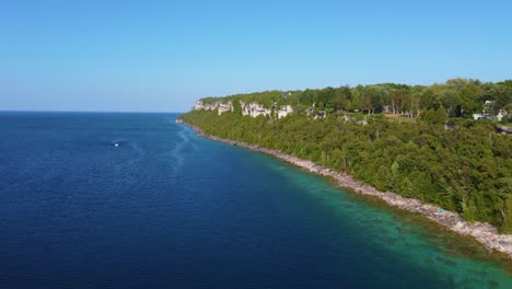 Aerial-Time-Lapse-Vertical-Cliff-on-Bruce-Peninsula-Covered-by-Lush-Pine-Trees-Georgian-Bay