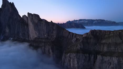 Sunrise-filmed-in-the-mountains-above-clouds-with-a-drone-in-the-Italian-Alps,-Dolomites,-Seceda