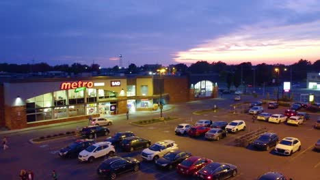 Metro-store-car-park-establishing-aerial-during-blue-hour