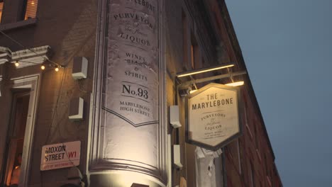 Tilting-shot-of-the-facade-and-sign-of-Marylebone-bar-in-London-United-Kingdom