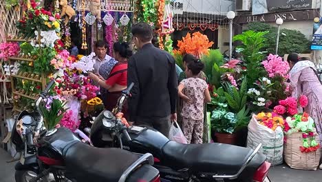 pov-shot-Lots-of-people-looking-at-flowers-in-a-flower-shop