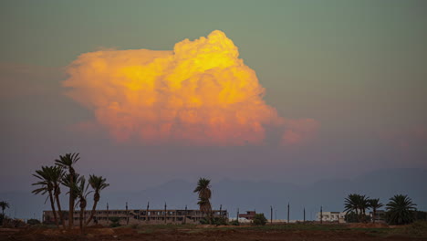 Shot-of-sunset-sky-with-dramatic-cumulus-clouds-in-motion-in-timelapse