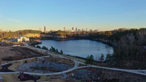 Panoramic-aerial-view-of-Westside-Reservoir-Park-overlooking-downtown-Atlanta-skyline,-Georgia,-USA