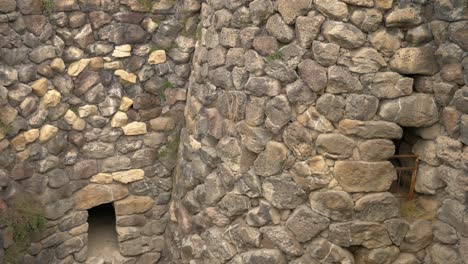 Inside-the-Nuraghe-Barumini-in-Sardinia,-Italy-Tilting-shot-on-this-ancient-and-mysterious-building