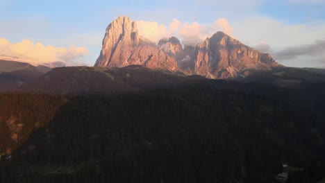 Huge-mountain-filmed-with-a-drone-in-the-Italian-alps-during-sunset-in-the-Dolomites-mountains