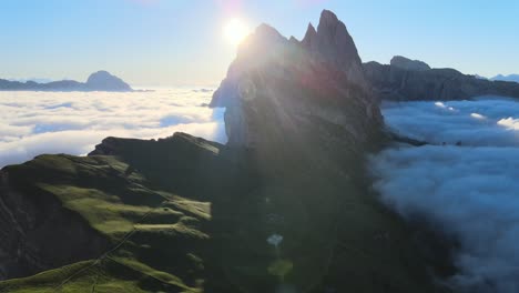Sunrise-filmed-with-a-drone-in-the-Italian-Alps,-Dolomites-from-above-clouds