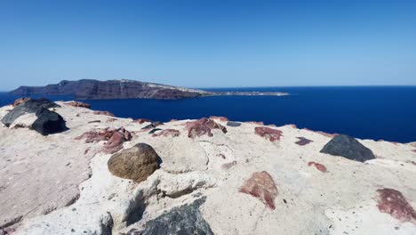 Oia-Santorini-Greece-Island-Travel-Tourist-Immersive-Walk,-Europe,-4K-|-Greek,-Aegean,-Sea,-Cliffside,-Ocean,-City,-Vacation,-Shopping,-White,-Marble,-Crowd,-Flowers,-Traveler,-People,-Crowded,-Dress