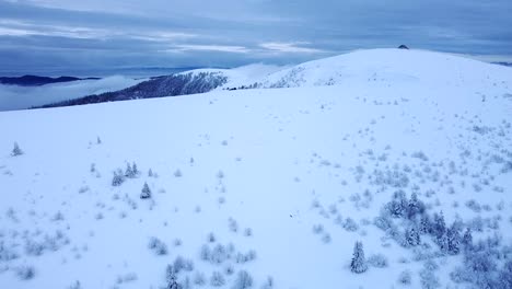 Aerial-winter-landscape-reveal-of-snow-capped-Hohneck-peak-in-Hautes-Vosges,-France