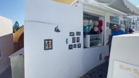 Oia-Santorini-Greece-Island-Travel-Tourist-Immersive-Walk,-Europe,-4K-|-Greek,-Aegean,-Sea,-Cliffside,-Ocean,-City,-Vacation,-Shopping,-White,-Marble,-Crowd,-Flowers,-Traveler,-People,-Cafe,-Elderly